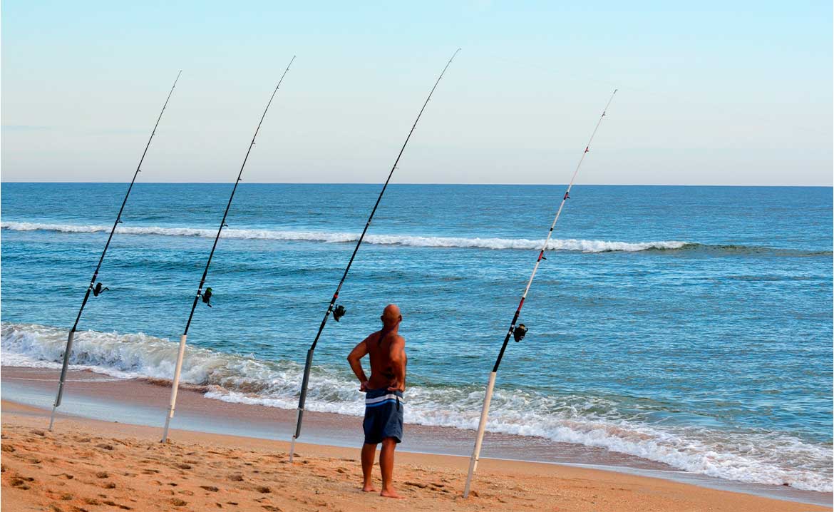 Man fishing in the shoreline