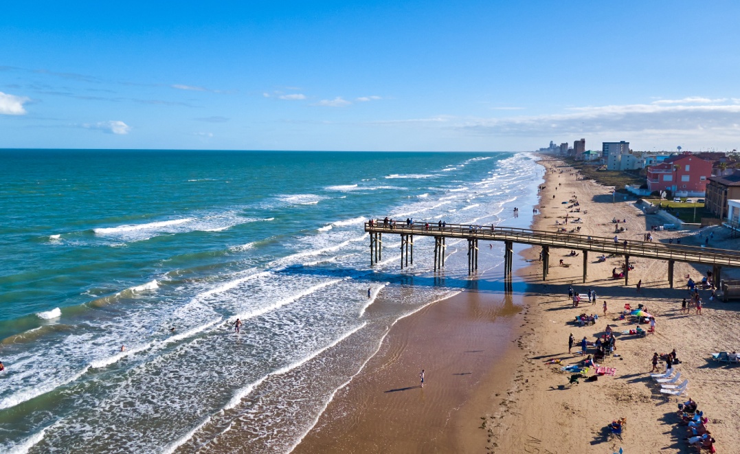 Beautiful Beach View at South Padre Island with Wooden Pier in Distance