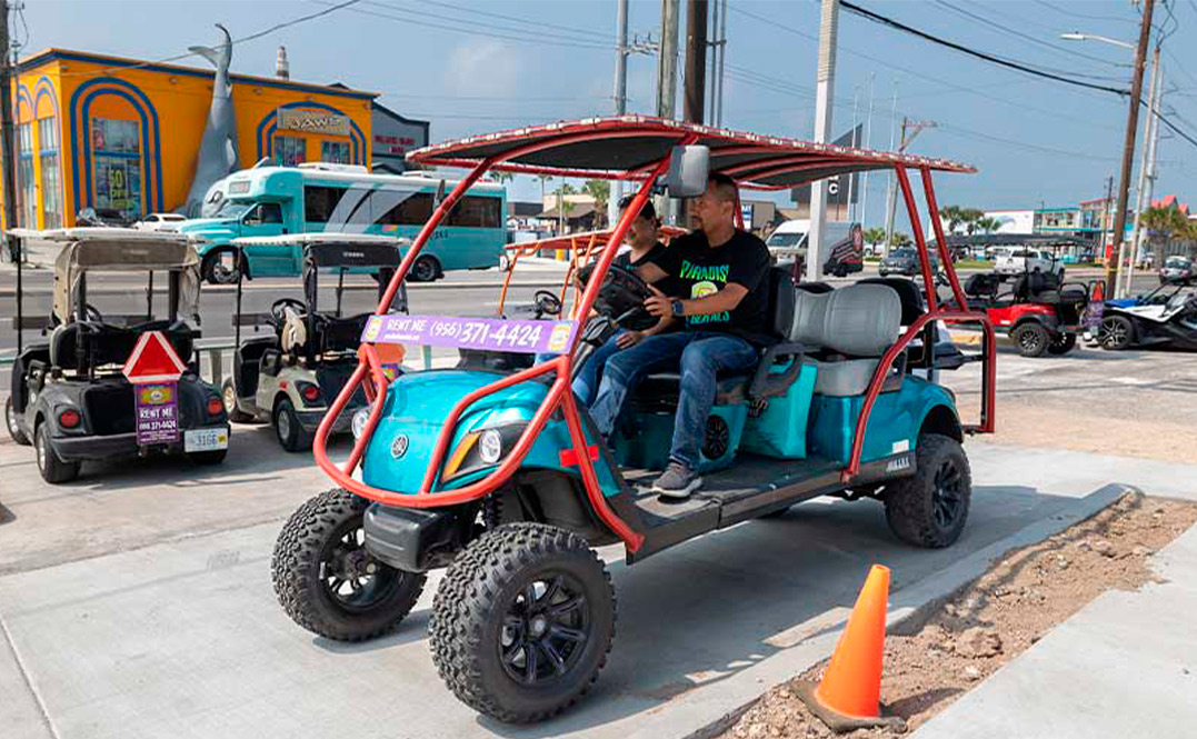 A man operating a golf cart on the street, highlighting the choice between 4-seater and 8-seater carts for SPI adventures.